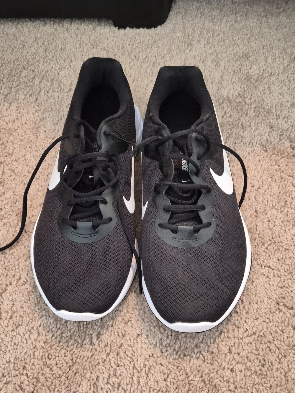 Nike Men’s Black Running Shoes with White Swoosh